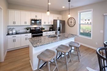 White shaker cabinets with matte black hardware